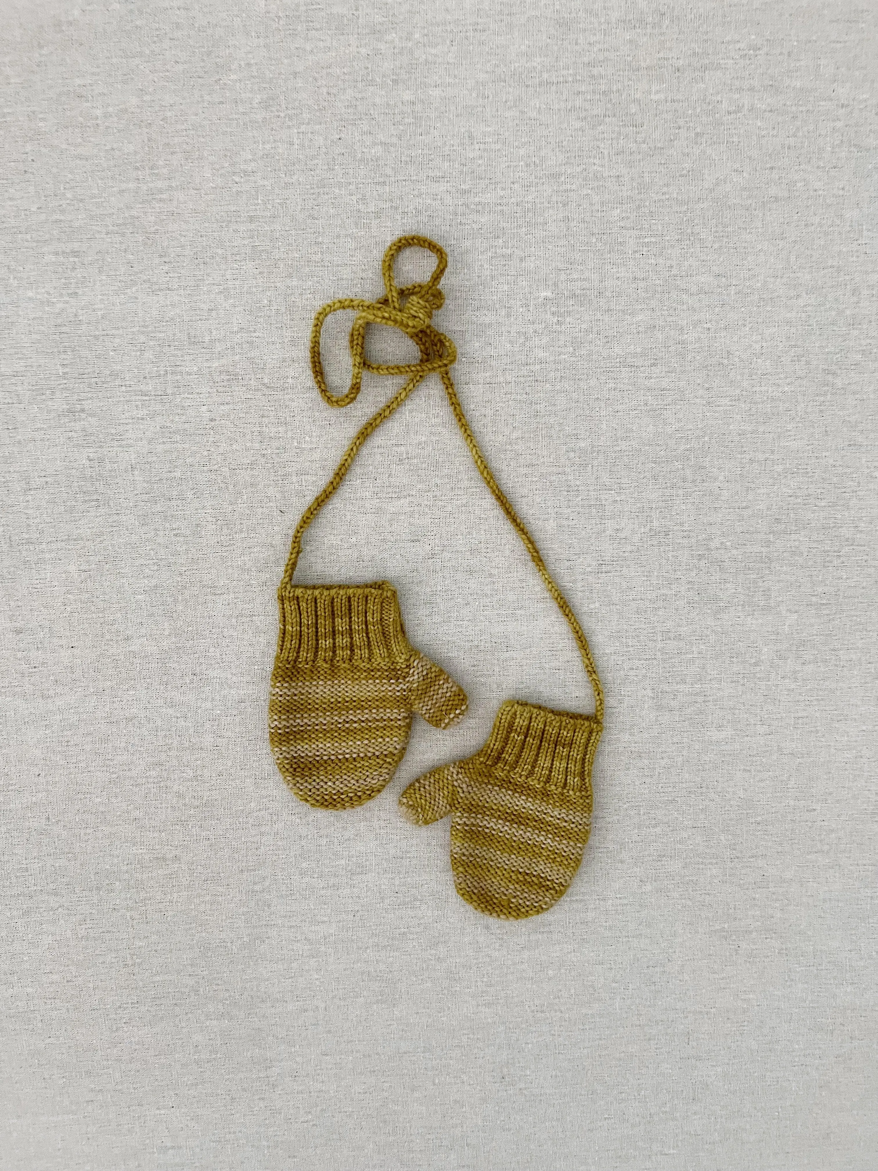 handknit striped mittens in chartreuse